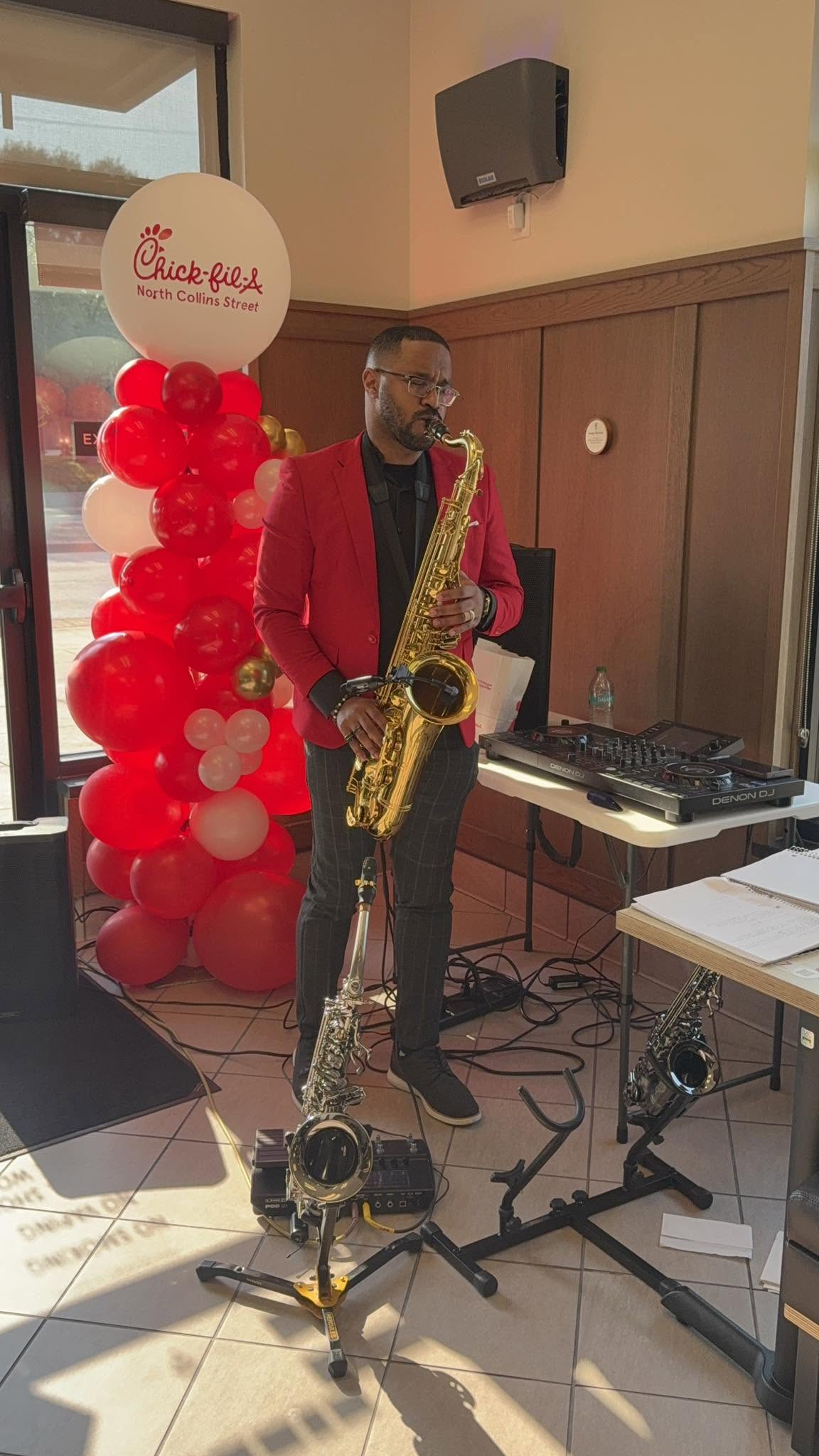 Alexander Davis performing live saxophone at a Chick-fil-A event
